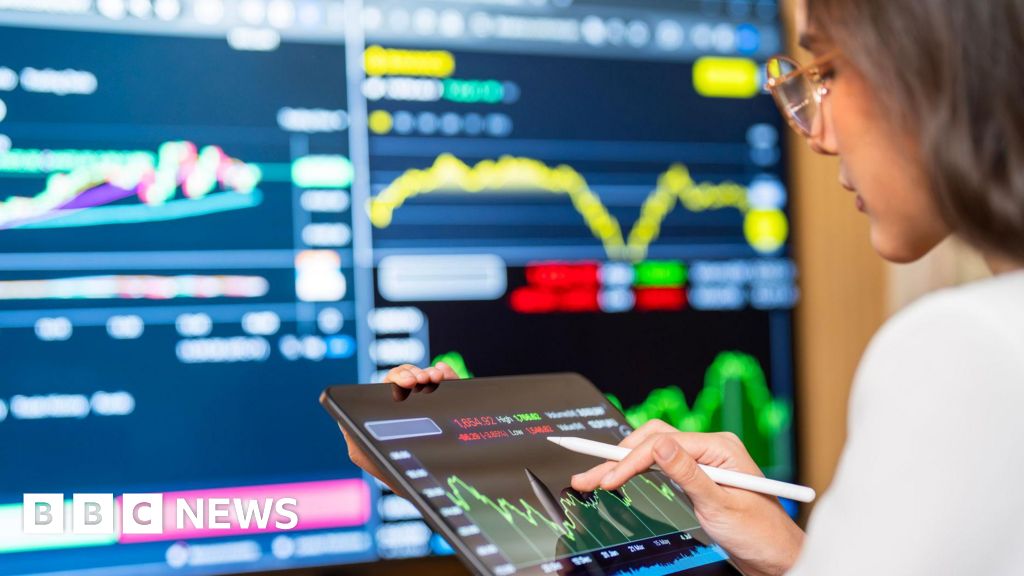 FTSE 100 index hits 10,000 milestone in new year rally.