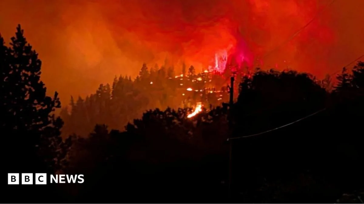 Fast-moving Canada wildfire doubles in size forcing thousands to flee homes.